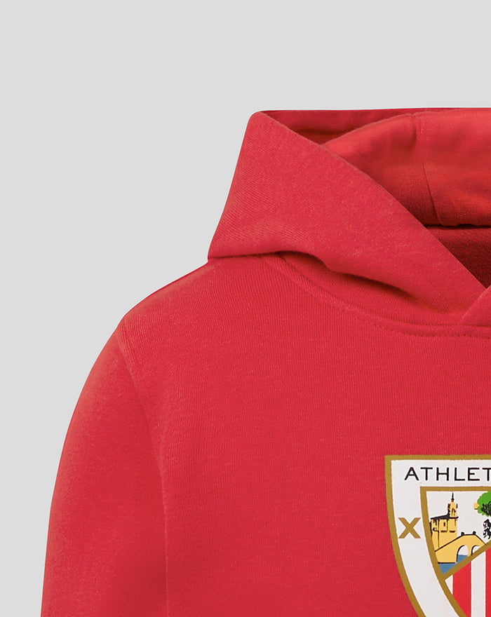 Red JUNIOR CORE OTH HOODY close up of hood and chest with partial crest badge