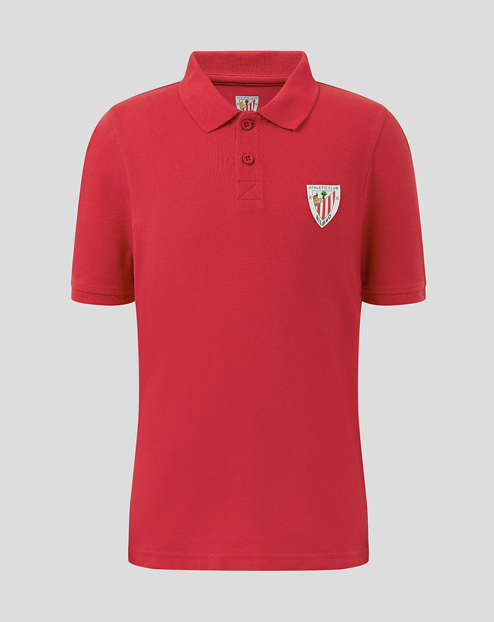 Red JUNIOR CORE POLO with polo collar and crest on left chest