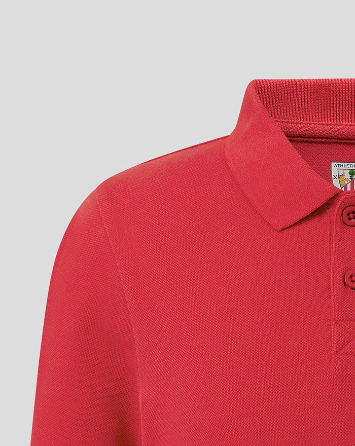 Close-up of red polo shirt collar and shoulder detail