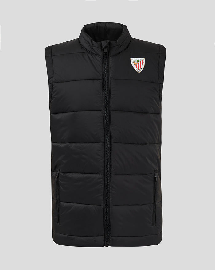 Front view of black padded gilet with horizontal quilting, full length zipper and logo patch on the left chest.