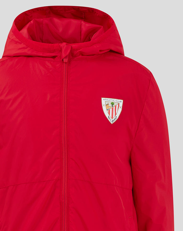 Red hooded Junior Core Summer Jacket close up showing front zipper and chest emblem