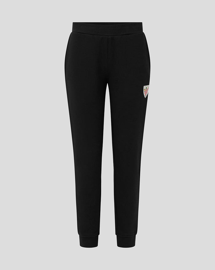 Black junior joggers with a ribbed waistband and cuffs and a small team crest on the thigh