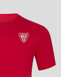 Close up of the white crest logo on the red ATHLETIC CLUB CORE CREST TEE.