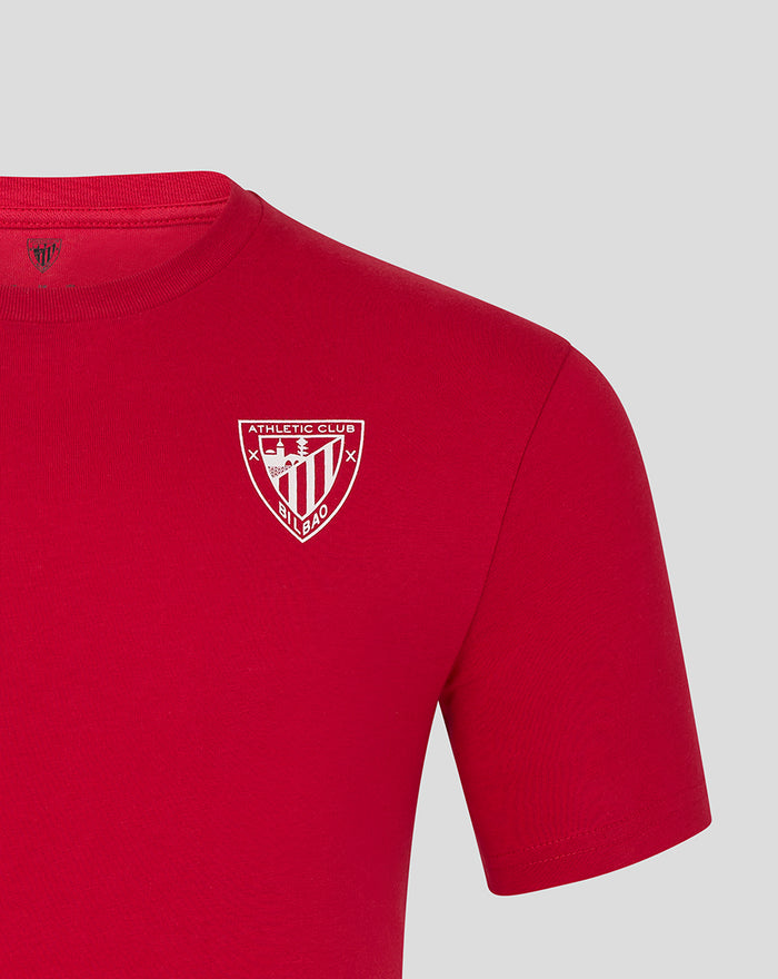 Close up of the white crest logo on the red ATHLETIC CLUB CORE CREST TEE.