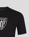 Black tee featuring a white crest logo on the chest.