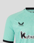 Mint green Athletic Club Bilbao third jersey front chest with Castore logo on the right, shield crest on the left, and Kutxa sponsor across.