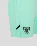 Close-up of mint green Athletic Club Third Shorts showing side panel detail and crest patch at the hem