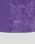 Close up of purple AerTek fabric with geometric pattern and hem stitching on the goalkeeper jersey