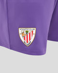 Close up of purple goalkeeper shorts showing the Athletic Club Bilbao crest patch on the left thigh