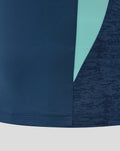 Lower front of navy athletic club tee showing teal side panel and textured sleeve detail.