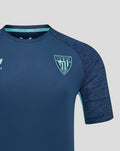 Close-up of navy athletic club tee chest with crest on left and Castore logo on right.