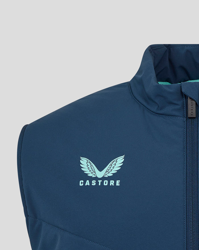 Close-up of the blue gilet chest showing a light blue Castore logo beside the zipper