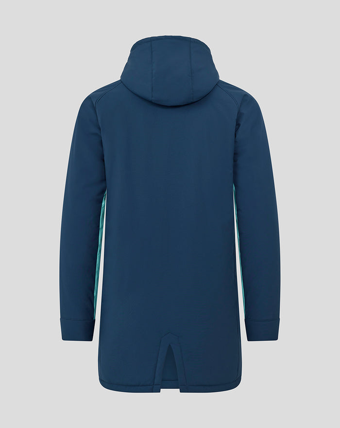 Back view of a long navy padded hooded jacket with teal side panels.