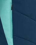Mint zipper stripe on navy padded jacket with diagonal seam color block detail