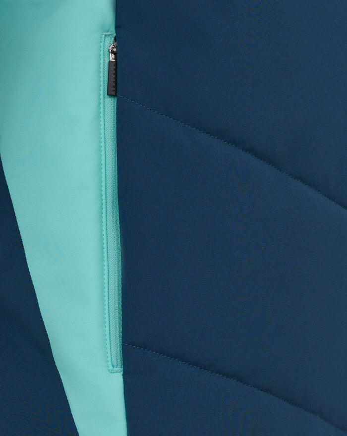 Mint zipper stripe on navy padded jacket with diagonal seam color block detail