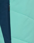 Close up of mint green and navy fabric with front zipper on ATHLETIC CLUB PERFORMANCE PADDED JACKET
