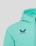Close up of turquoise padded jacket chest showing the Castore logo and front zipper