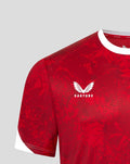 Red Athletic Club home jersey close up with white collar trim, Castore logo on the right chest and club crest on the left