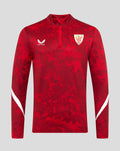 Front view of red Athletic Club Pre Match Midlayer Top with quarter-zip abstract print Castore logo on right chest left crest