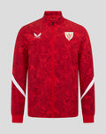 Front view of red Athletic Club Home Pre Match Jacket with Castore logo on the right chest, club crest on the left chest, and white sleeve panels.