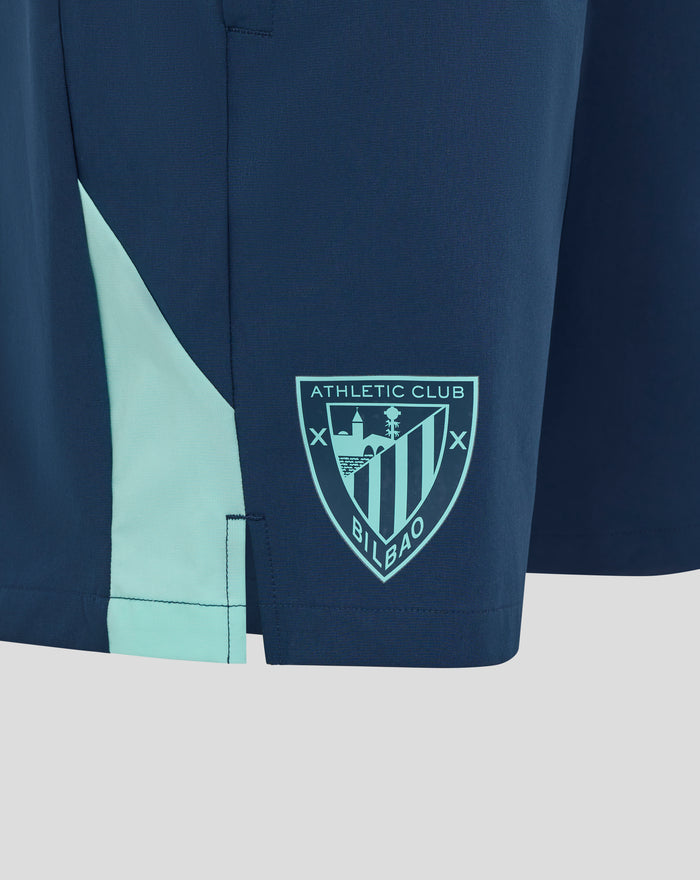 Navy athletic club shorts with teal side panel and crest on the leg