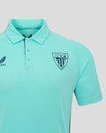 Close up of turquoise polo chest showing Athletic Club Bilbao crest and Castore logo