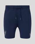 Navy Athletic Club Travel Knit Shorts with a drawstring waistband and crest logo on the left leg.