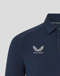 Close up of navy athletic club travel polo showing crest on the chest and collar detail