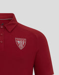 Athletic Club Bilbao crest on the chest of a red polo shirt.