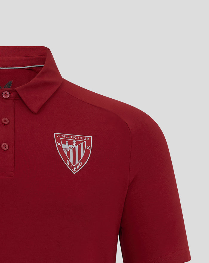 Athletic Club Bilbao crest on the chest of a red polo shirt.