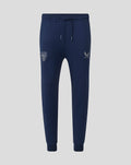 Navy travel knit pant with drawstring waist and tapered cuffs featuring crest on the left thigh and Castore logo on the right