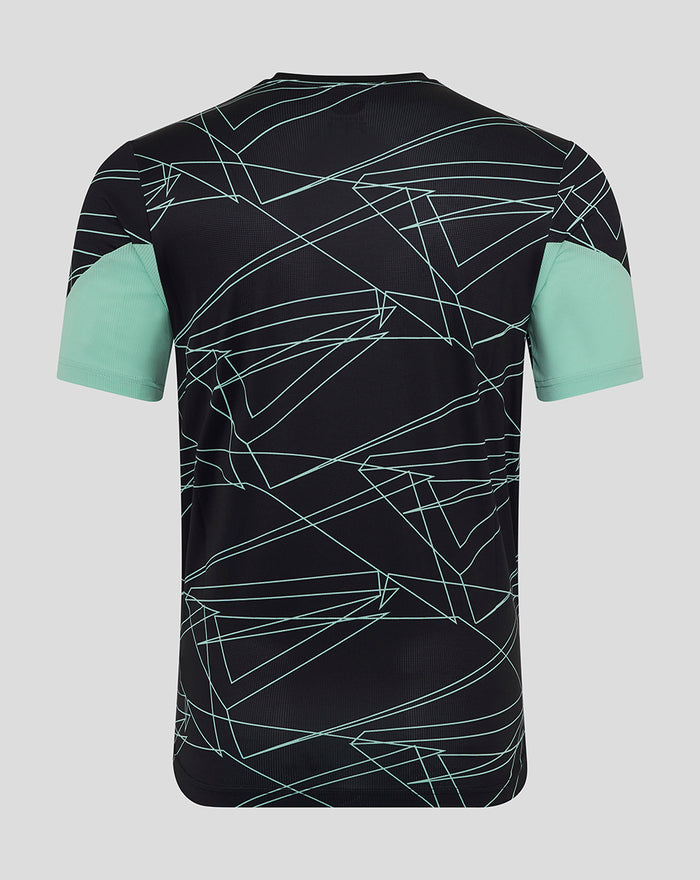 Back view of black training tee with mint geometric lines and mint sleeve cuffs