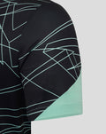 Sleeve close up of the Athletic Club tee showing mint geometric pattern and mint cuff.