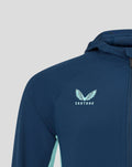 Close up of navy jacket chest showing Castore logo and front zipper detail
