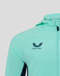 Mint green athletic jacket close up of shoulder and chest area with Castore logo and zipper.