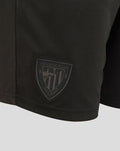 Close up of the shield logo patch on the Athletic Club Retro Short Junior