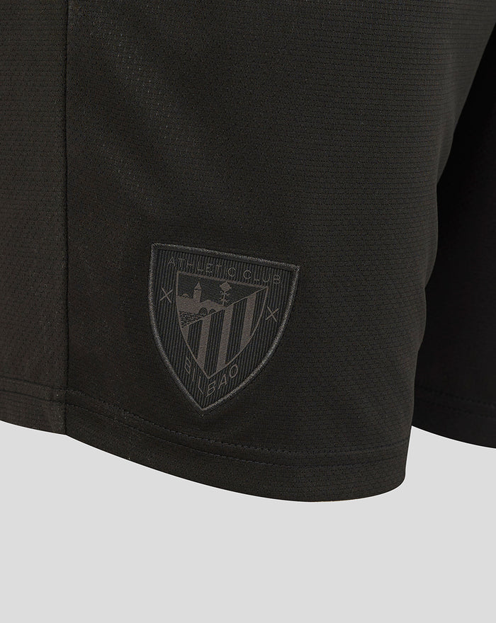 Close up of the shield logo patch on the Athletic Club Retro Short Junior