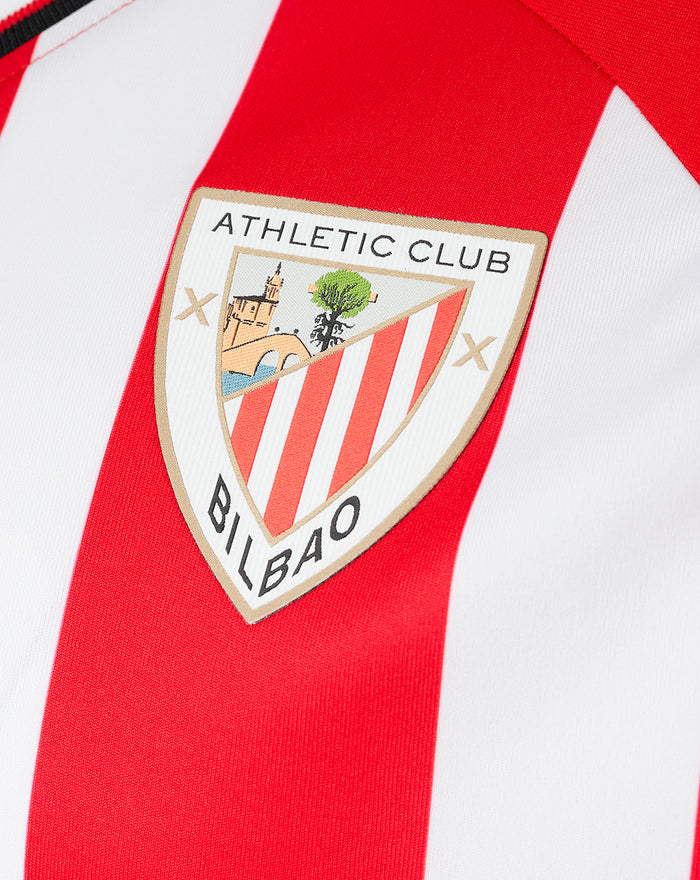 Athletic Club Bilbao crest patch on red and white striped jersey.