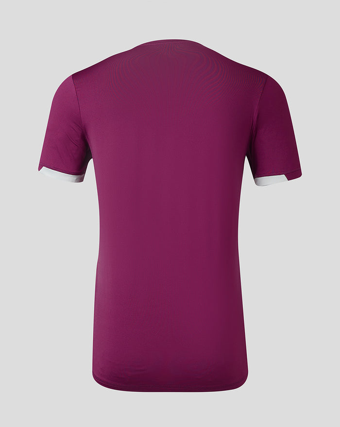 Back view of burgundy kids travel jersey showing plain back and white cuff details on the sleeves