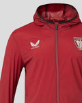 Detail of red windrunner jacket with Athletic Club Bilbao crest on chest and Castore branding visible