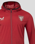 Front close up of red windrunner jacket with hood, Castore logo and Athletic Club Bilbao crest
