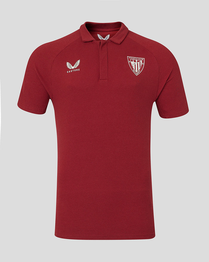 Red athletic polo shirt for Athletic Club Bilbao with white crest on the left chest and Castore logo on the right.