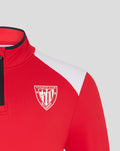Close up of the red top with a white shoulder panel and the Athletic Club Bilbao crest on the chest