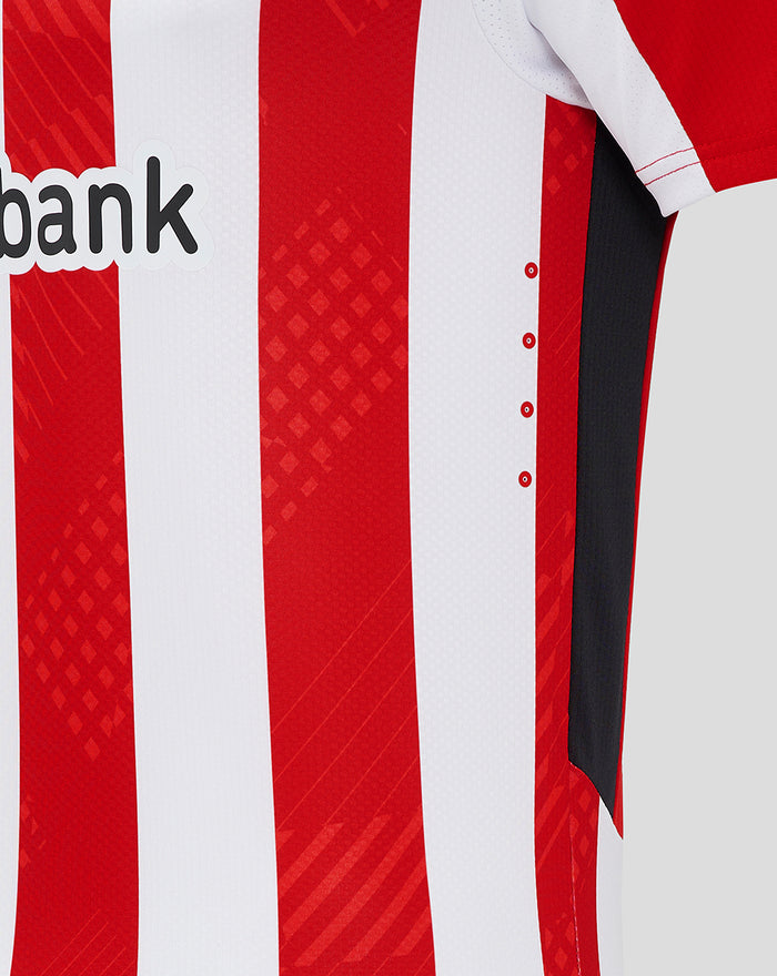 Side view of the home shirt showing red and white stripes and a contrasting side panel