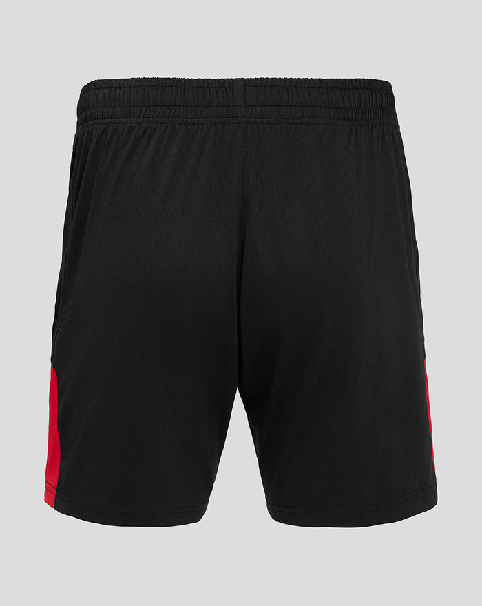 Back view of black shorts with a red side stripe along the outer edge