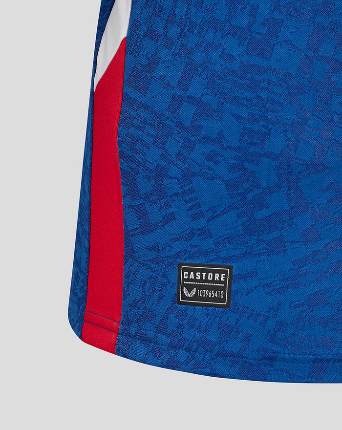 Close up of blue men's 24/25 Pro Away shirt showing a red side panel and Castore badge.