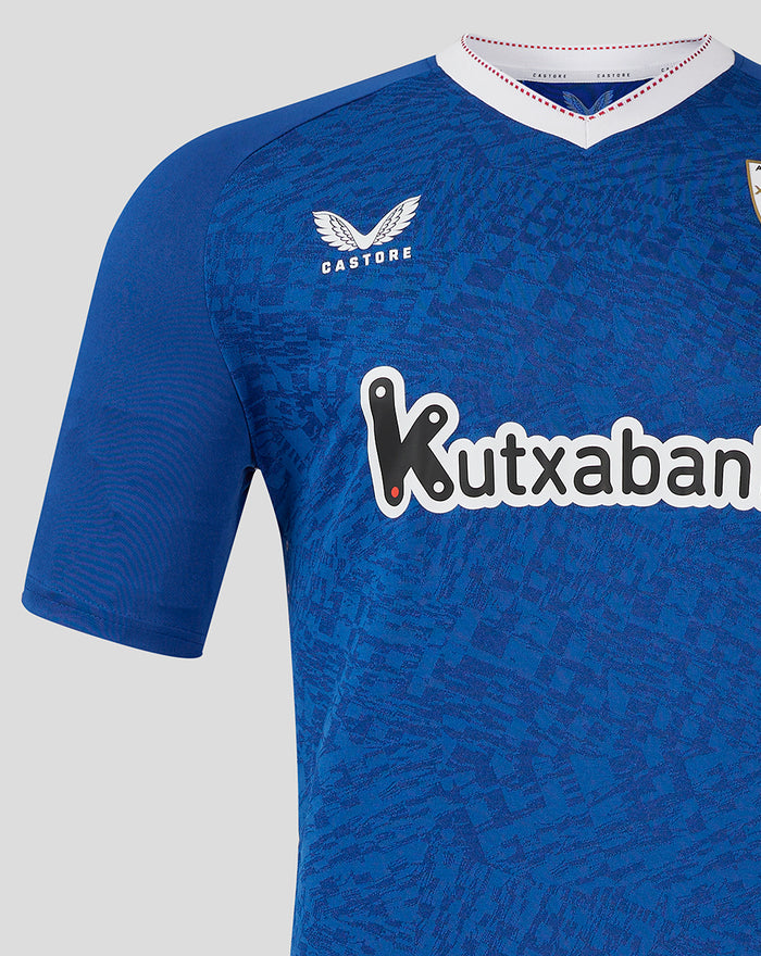 Front view of blue away shirt with Kutxabank sponsor across chest and team crest on the left
