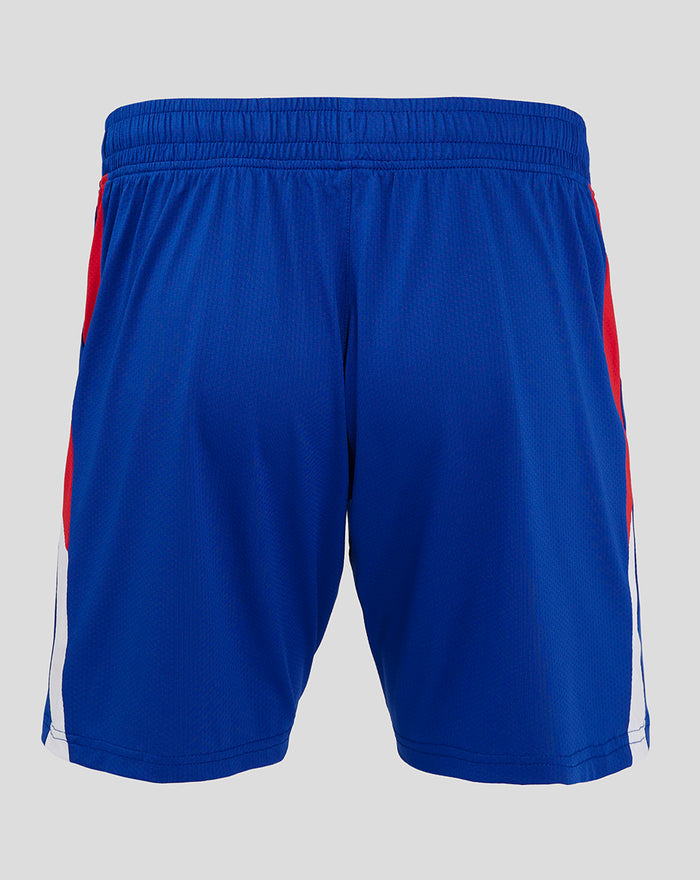 Back view of blue Pro Away shorts with red side panels and elastic waistband