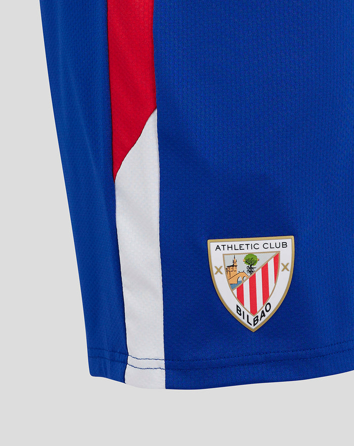 Close up of blue athletic shorts showing the Athletic Club Bilbao crest and white side trim