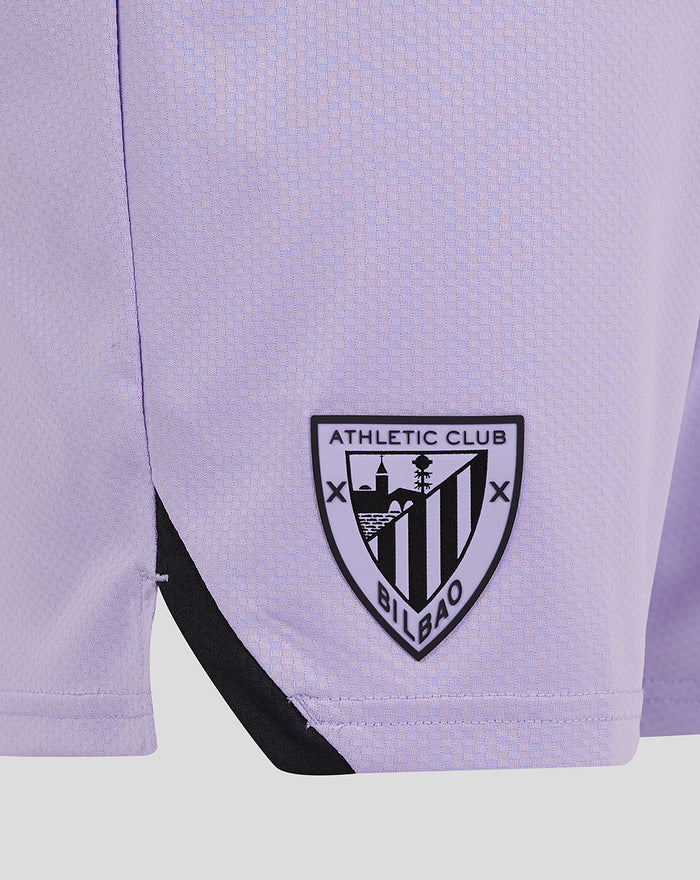 Close-up of lavender fabric showing Athletic Club Bilbao crest on the left leg